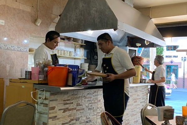 Inside Taquería Selene — the counter and al pastor trompo